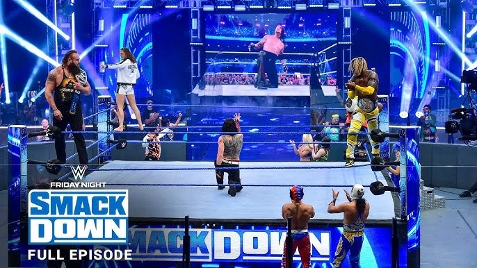 A promotional image for WWE SmackDown Episode 1450 featuring wrestlers in action inside a wrestling ring, with dramatic lighting and intense facial expressions.